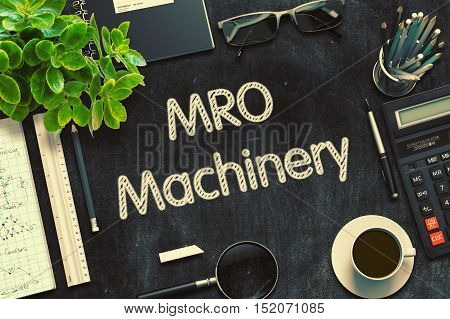 MRO Machinery - Text on Black Chalkboard.3d Rendering. Toned Illustration.
