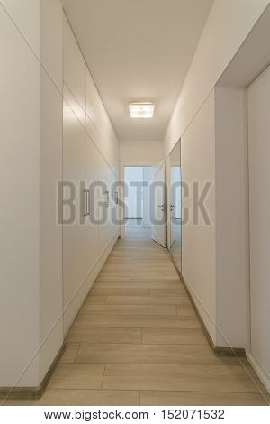 Light interior with flooring in a modern apartment. Stylish beautiful living flat.
