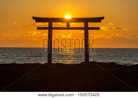 Toroii Japanese shrine gate sunrise at sea Oarai city , Ibaraki Japan