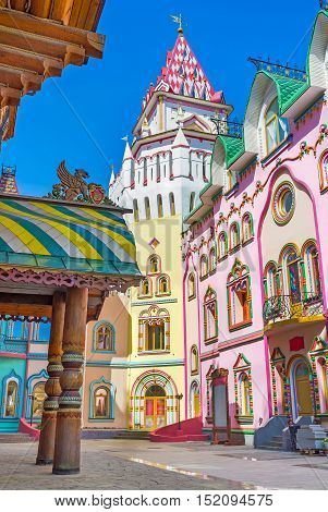 The colorful mansions of art galleries souvenir stores and restaurants with the tower in corner Izmailovsky Kremlin Russia.