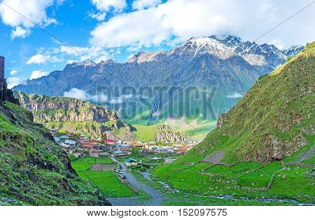 The way from Gergeti to the Stepantsminda along the green rocky slopes Kazbegi Georgia.