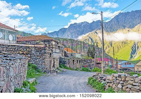 The old neighborhood of Stepantsminda resort located right at the mountain foot and on the consists of the stone houses Kazbegi Georgia.