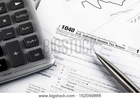 Caclulator and Pen on the Document with Graph - Close Up