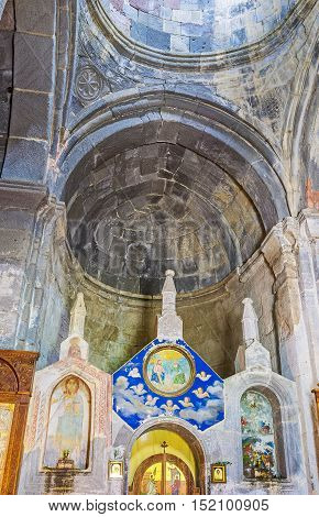 GERGETI GEORGIA - JUNE 3 2016: The interior of Tsminda Sameba (Holy Trinity) Church with old preserved carved decors and renovated icons on June 3 in Gergeti.