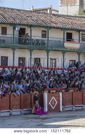 Chinchon Spain - October 15 2016: Traditional bullfighting stamp in the main square of chinchon during the festival charity Chinchon Madrid province Spain