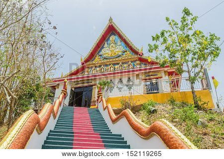 Phuket Thailand - April 25 2016 : The main stair leading to the replica of Phra That In-Kwaen (Hanging Golden Rock) at Sirey temple Phuket Thailand.