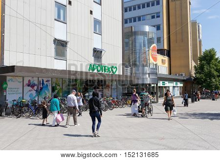 Solna, Sweden - June 3, 2016: People walkiing outside the Solna center mall.