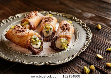Traditional Sicilian Cannoli Stuffed With Ricotta And Pistachios