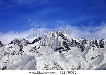 Snow Mountains In Winter Sun Day And Blue Sky With Clouds