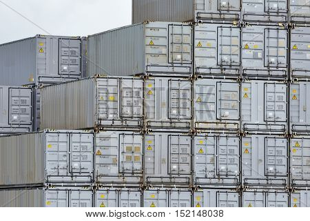 Stacked containers in a shipping terminal