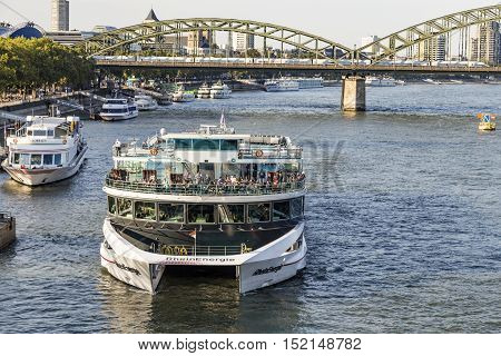 COLOGNE GERMANY - SEP 21 2016: people enjoy the cruise on river Rhine in late afternoon