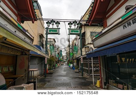 Tokyo Japan - Aug 29 2016: side street with local souvenir shops and cafes near Senso-ji temple Asakusa district. Small streets in Tokyo do not have names