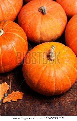 Autumn Pumpkin Thanksgiving Background - orange pumpkins over wooden table with copyspace