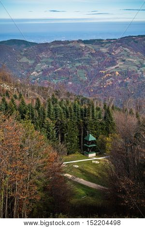 Small church on a mountain meadow surrounded by forest, Bobija mountain, west Serbia
