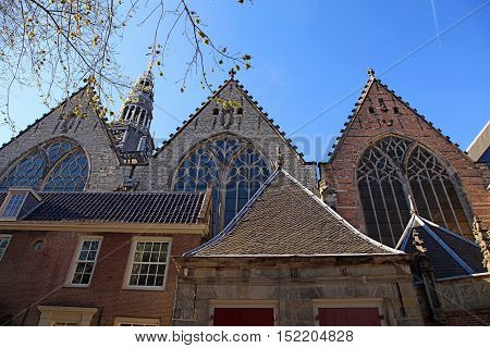 Old church in Amsterdam, Netherlands. The 800 year old Oude Kerk (Old Church) is Amsterdam oldest building and oldest parish church.