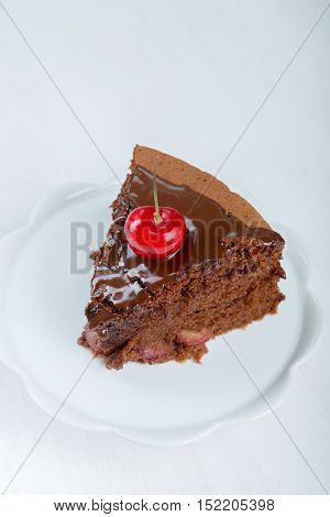 Chocolate cake with juicy cherries