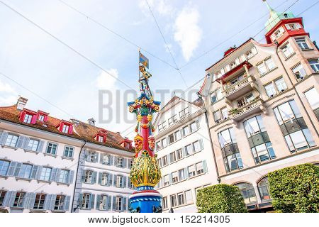 Colorful old fountain on the Kapell square in the old town of Lucerne in Switzerland