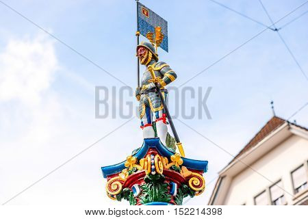 Colorful old fountain statue on the Kapell square in the old town of Lucerne city in Switzerland