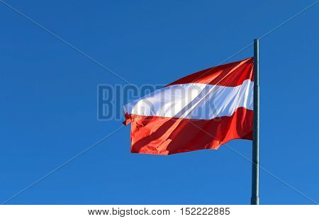 Great Austrian Flag Waving In The Blue Sky