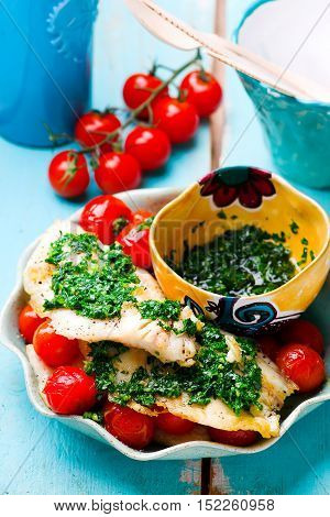 Lazy Fish.fried tilapia fillet with tomato.seletive focus