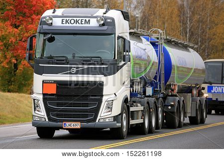 RAASEPORI, FINLAND - OCTOBER 15, 2016: White Volvo FH tank truck of Ekokem moves along road in autumn. Ekokem is a Nordic circular economy company providing comprehensive environmental management services.