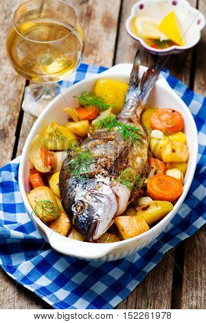 Oven Baked Fish and Vegetables. seletive focus