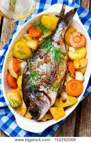 Oven Baked Fish and Vegetables. seletive focus