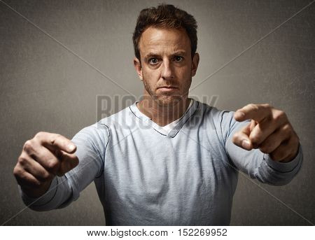 Man pointing to the camera.