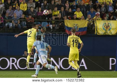 VILLARREAL, SPAIN - OCTOBER 16th:Mario and Bondonga fight for ball  during La Liga soccer match between Villarreal and Celta de Vigo at El Madrigal Stadium on October 16, 2016 in Villarreal, Spain