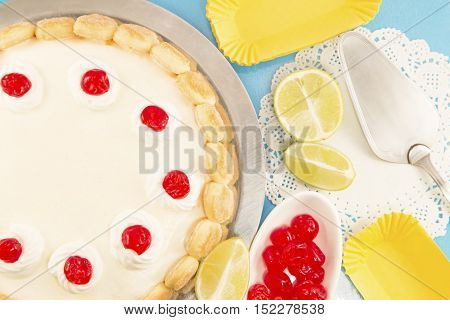 Cheesecake with candied cherries on a blue background