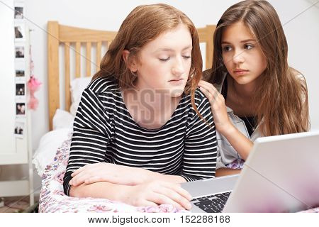 Teenage Girl With Friend Being Bullied On Line