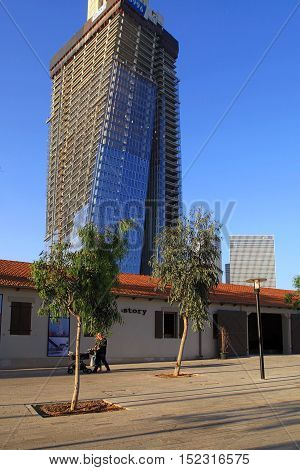 TEL AVIV, ISRAEL - APRIL 7, 2016: View of open air commercial center Sarona and skyscrapers, Tel Aviv, Israel. Open Sarona Market became most popular place in Tel Aviv.
