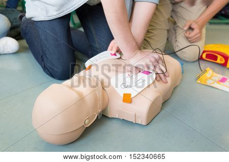 First aid cardiopulmonary resuscitation course using automated external defibrillator device, AED.