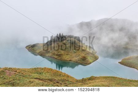 alpine lake in dense fog Bavaria Germany