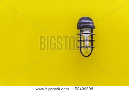 Closeup classic lamp on yellow wall background