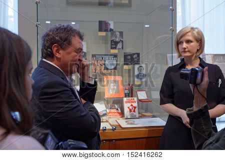 ST. PETERSBURG, RUSSIA - OCTOBER 7, 2016: People in the exhibition dedicated to 85th anniversary of Russian author Julian Semyonov in the Presidential library. People call him The Consummate Insider