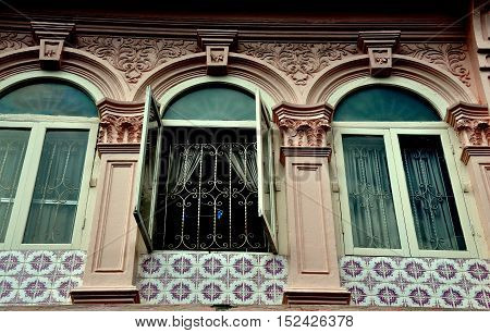 Phuket City Thailand - January 8 2011: Restored late 19th century Sino-Portuguese shop house with tiles ornamental pilasters and arched windows on Soi Rommanee
