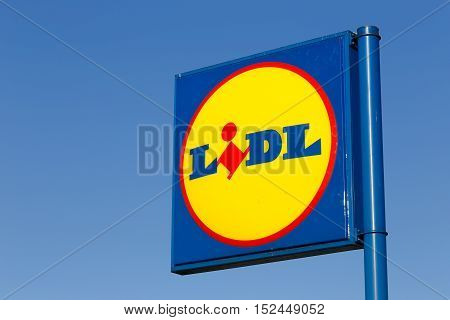 Hedemora, Sweden - March 13, 2015: Close up of the sign for the food chain Lidl against the blue sky