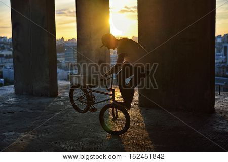 Bmx Freestyle. A Man On Bmx Doing Tricks.