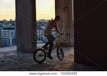 Bmx Freestyle. A Man On Bmx Doing Tricks.