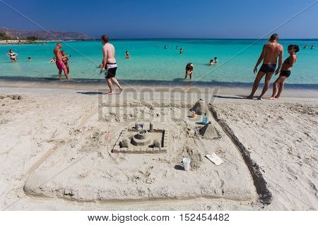 Elafonisi, Island Crete, Greece, - June 26, 2016: Swimming and relaxing people  on the beautiful beach of Elafonisi with pink sand