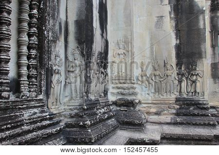 Angkor Wat's bas-relief carved into stone. Angkor Wat, Built by King Suryavarman II in Cambodia