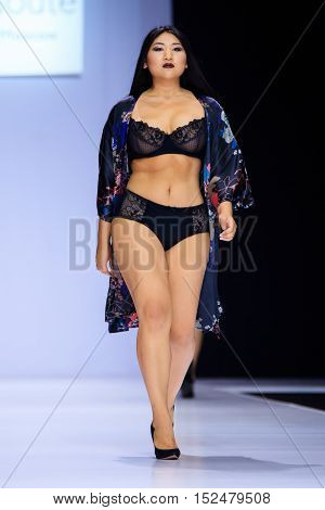 MOSCOW RUSSIA - OCTOBER 19 2016: Plus size model walk runway for LA REDOUTE & PLUS-SIZE MOSCOW catwalk at Spring-summer 2017 Moscow Fashion Week.