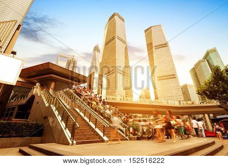 Escalator next to skyscrapers on the streets of Shanghai.