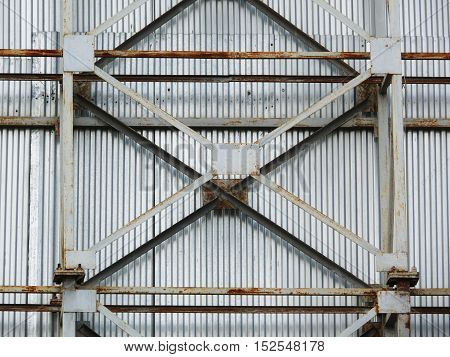 a large fence made of metal frame and sheet.