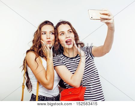 two best friends teenage girls together having fun, posing emotional on white background, besties happy smiling, lifestyle people concept close up