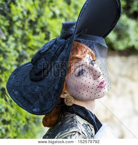 CAGLIARI, ITALY - May 29, 2016: Sunday at La Grande Jatte VIII Ed. At the Public Gardens - Sardinia - portrait of a beautiful woman in Victorian costumes