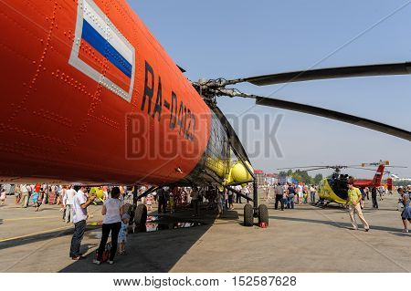 Tyumen, Russia - August 11, 2012: Air show On a visit at UTair in heliport Plehanovo. People explore the MI-10K helicopter