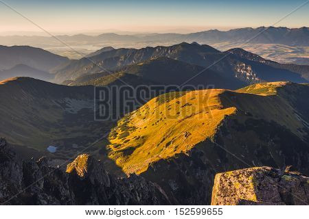 Mountain Landscape at Sunset. View from Mount Dumbier in Low Tatras Slovakia. West Tatras Mountains and Liptovska Mara Dam in Background.