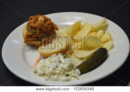 pork slider sandwich on a plate apple coleslaw
